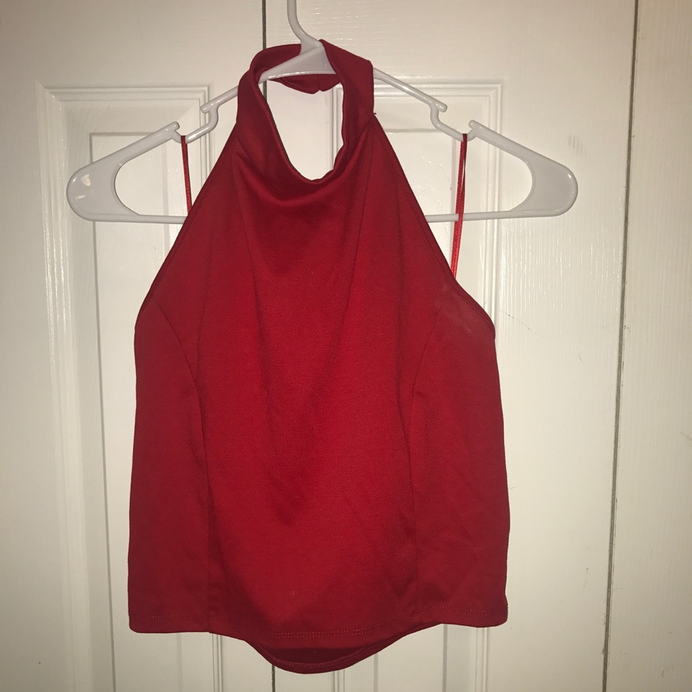 Red high neck low back shirt.